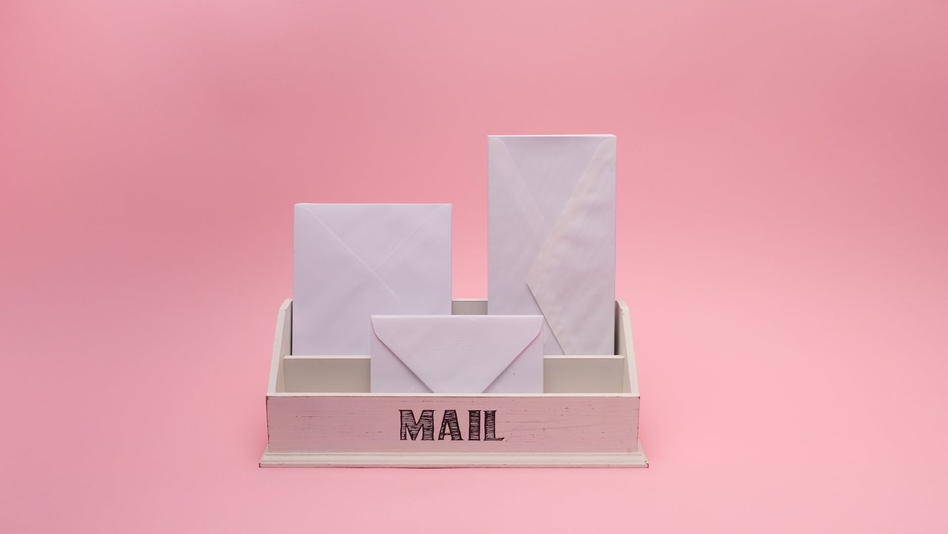 DG Speaks - Contact Us - White envelopes in mail organizer