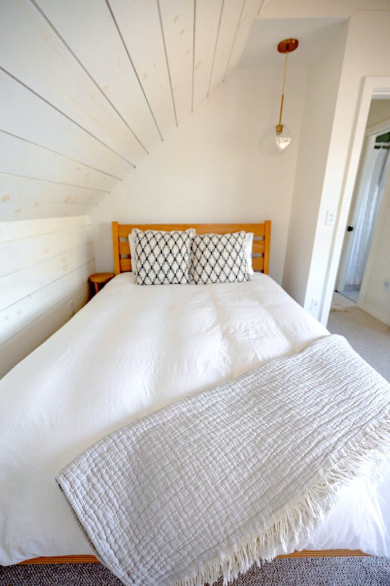 DG Speaks - Money - Airbnb - Photograph of a bed with a white sheet and pillows