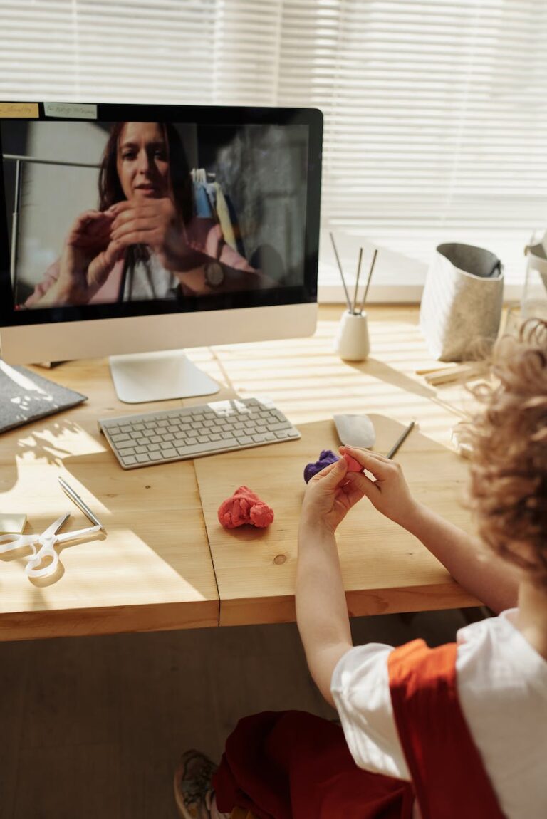 DG Speaks - Travel - Money - Photo of kid playing with clay while looking in the monitor