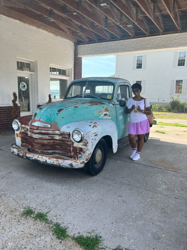 DG Speaks - Travel - Mercedes back at home in NC standing beside an old truck