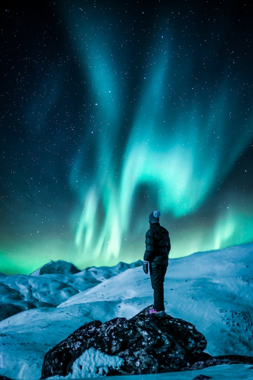 DG Speaks - Analysis - Man standing on a rock near snow covered land