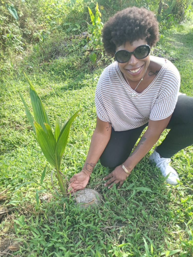 DG Speaks - Sustainable Development - Mercedes with baby coconut tree in Guyana