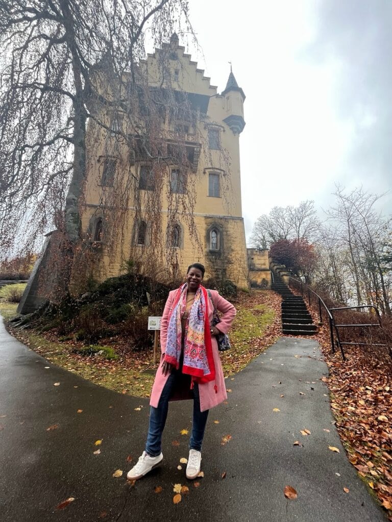 Mercedes posing in from of Hohenschwangau Castle