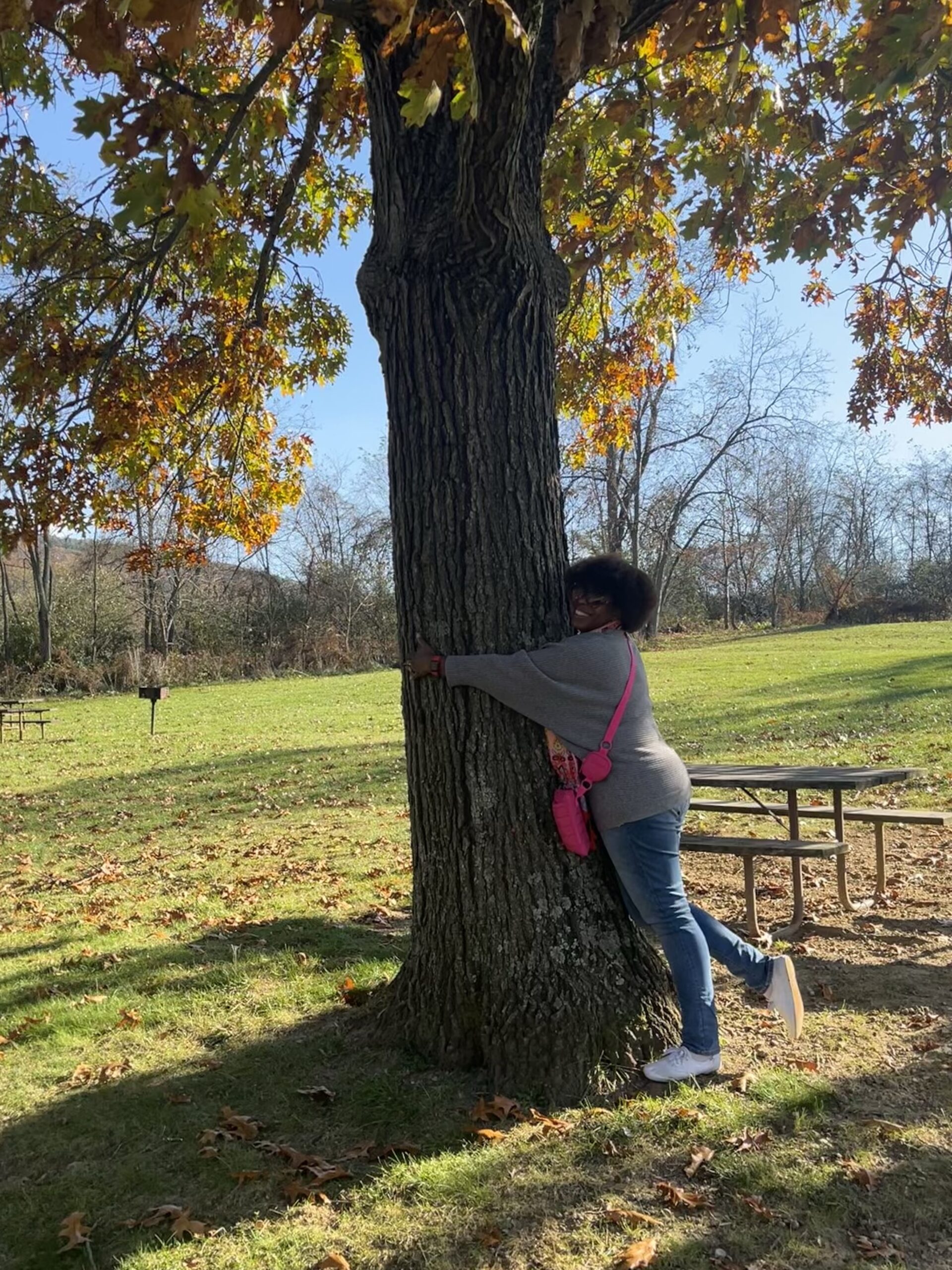 DG Speaks - Earth Month - Mercedes happily hugging a tree in Maryland