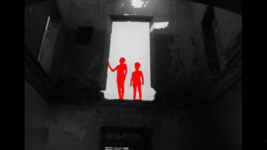 A dramatic still from A Fidai Film, showing archival footage overlaid with vibrant red imagery symbolizing resistance and reclamation.