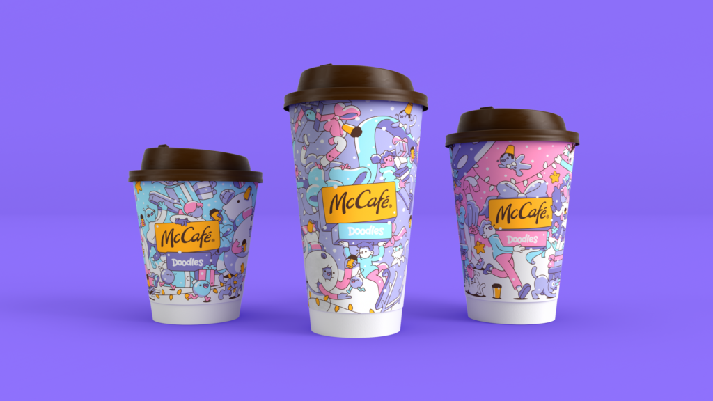 McDonald’s McCafé holiday cups designed by Doodles, featuring cheerful pastel artwork and festive colors.