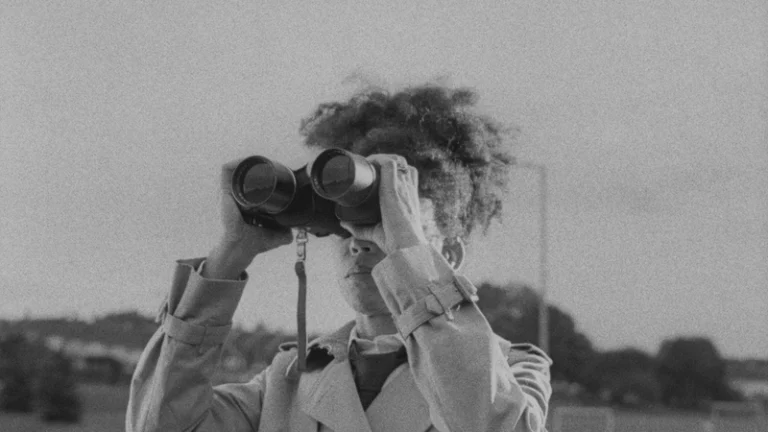 Hemel still showing woman with binoculars