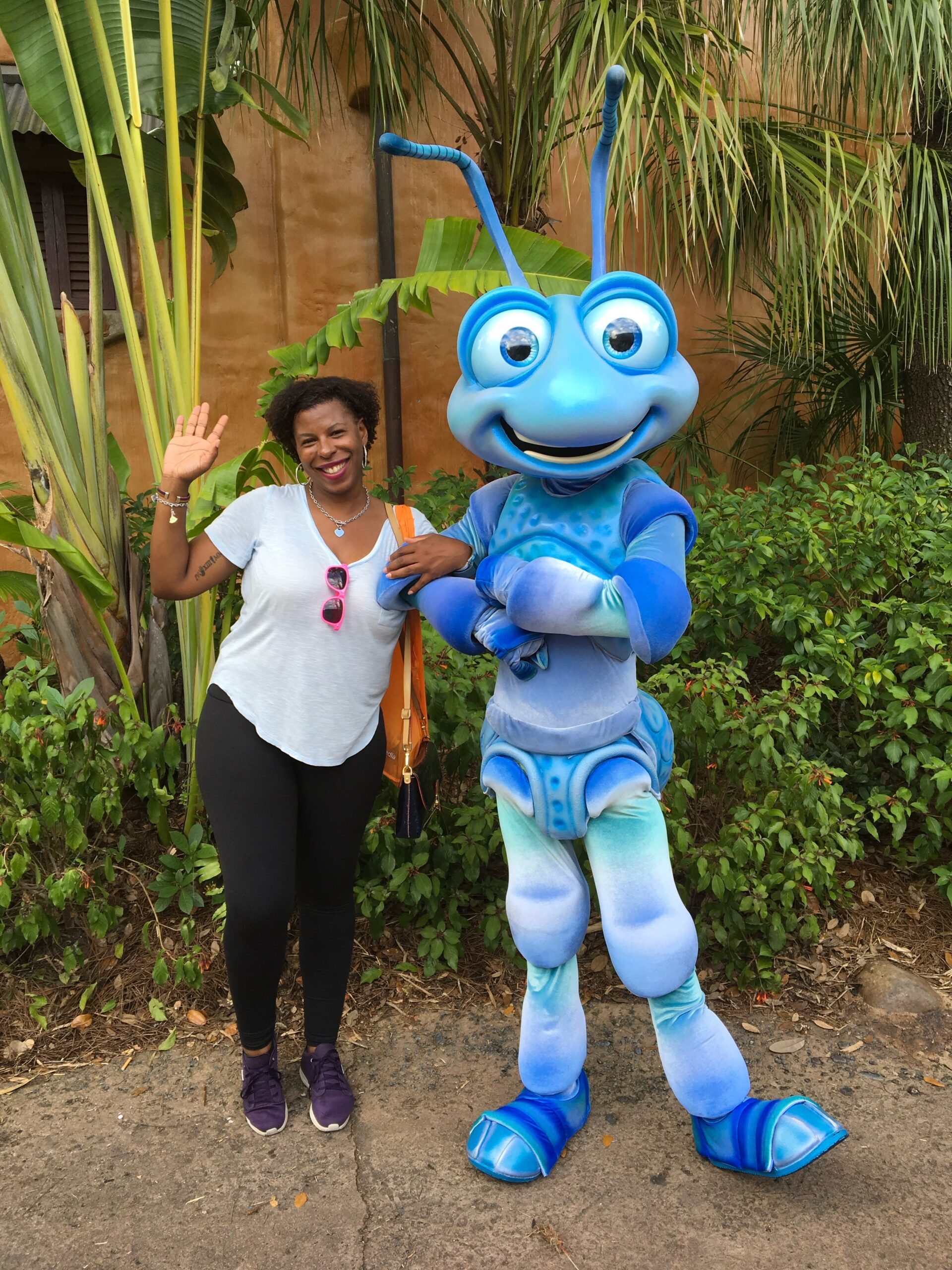 Mercedes having fun with her Disneyland ticket posing with blue ant