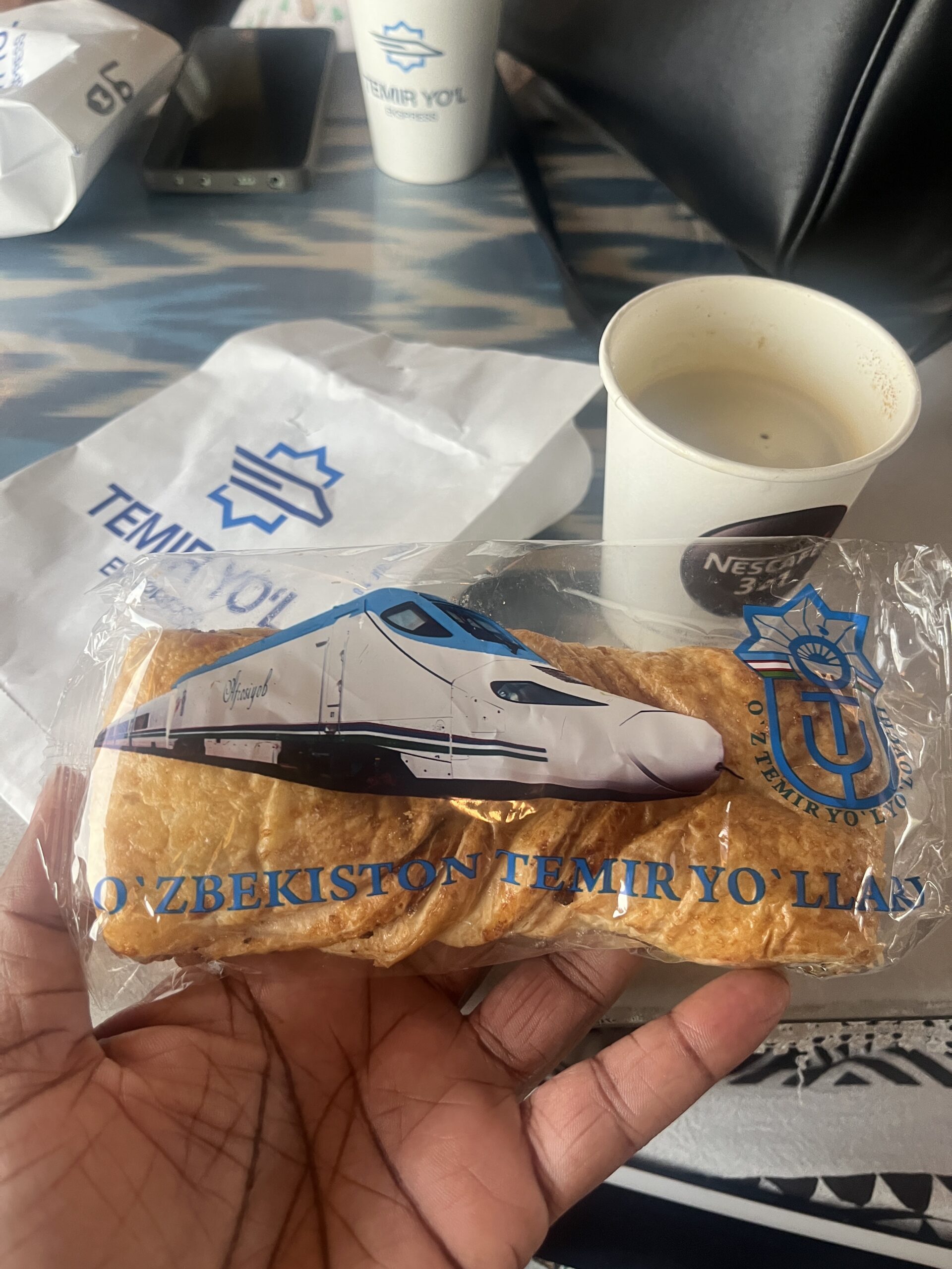 Snack and coffee from train station cafe in Uzbekistan