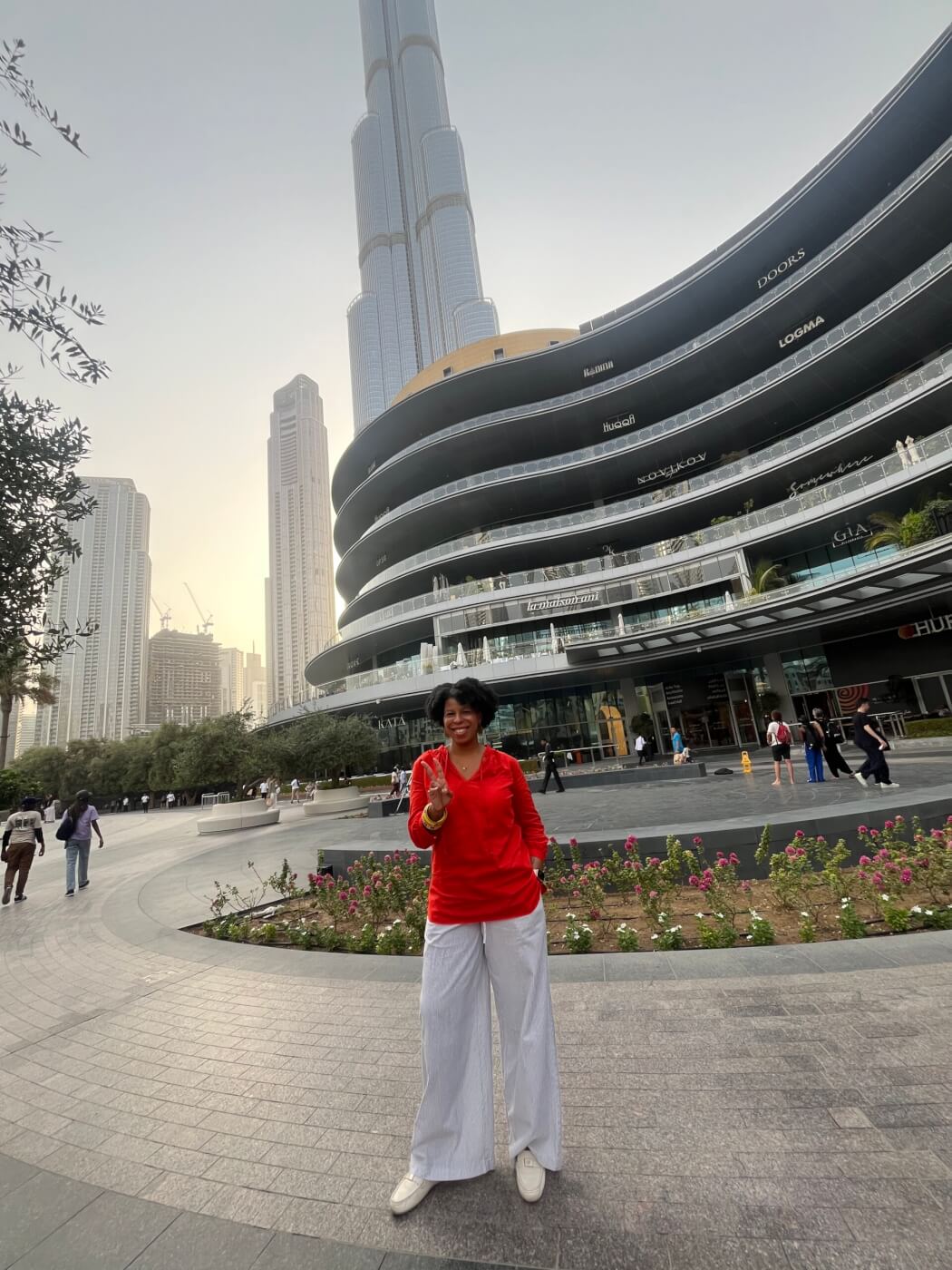 Mercedes standing in front of the Burj Khalifa during her 3 days in Dubai.