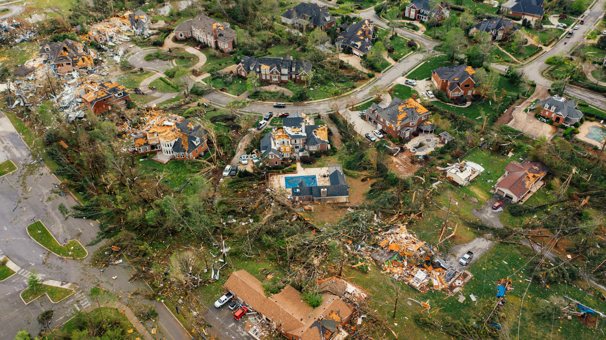 Aerial view showing severe tornado damage in Chattanooga, Tennessee neighborhood for tornado watch vs warning.