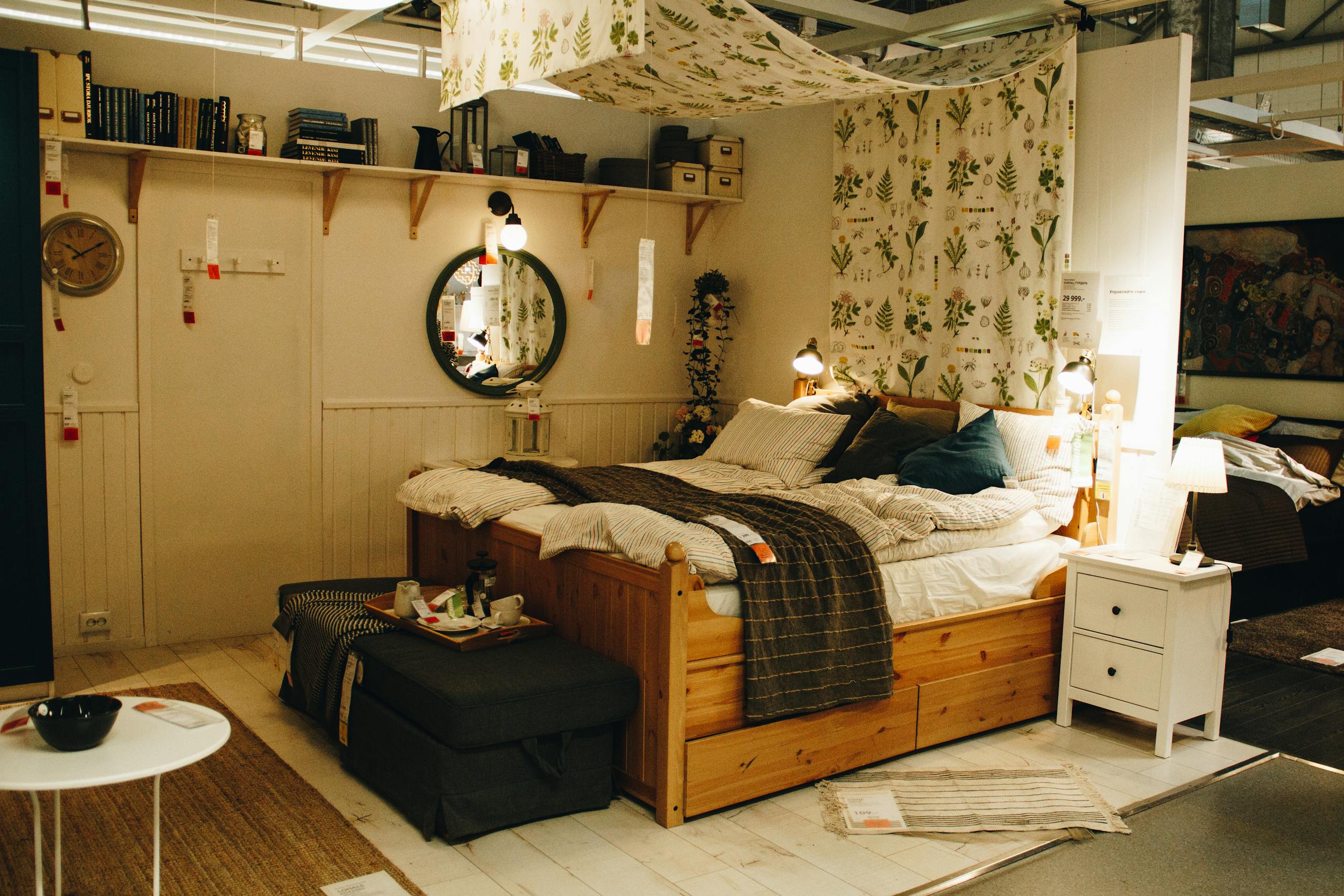 Cozy and modern bedroom setup in an Airbnb rental showing airbnb hosting for women living out loud with warm lighting, wooden furniture, and decorative rugs.