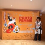 Mercedes opening night of the Porto Femme Film Festival standing in front of the banner.