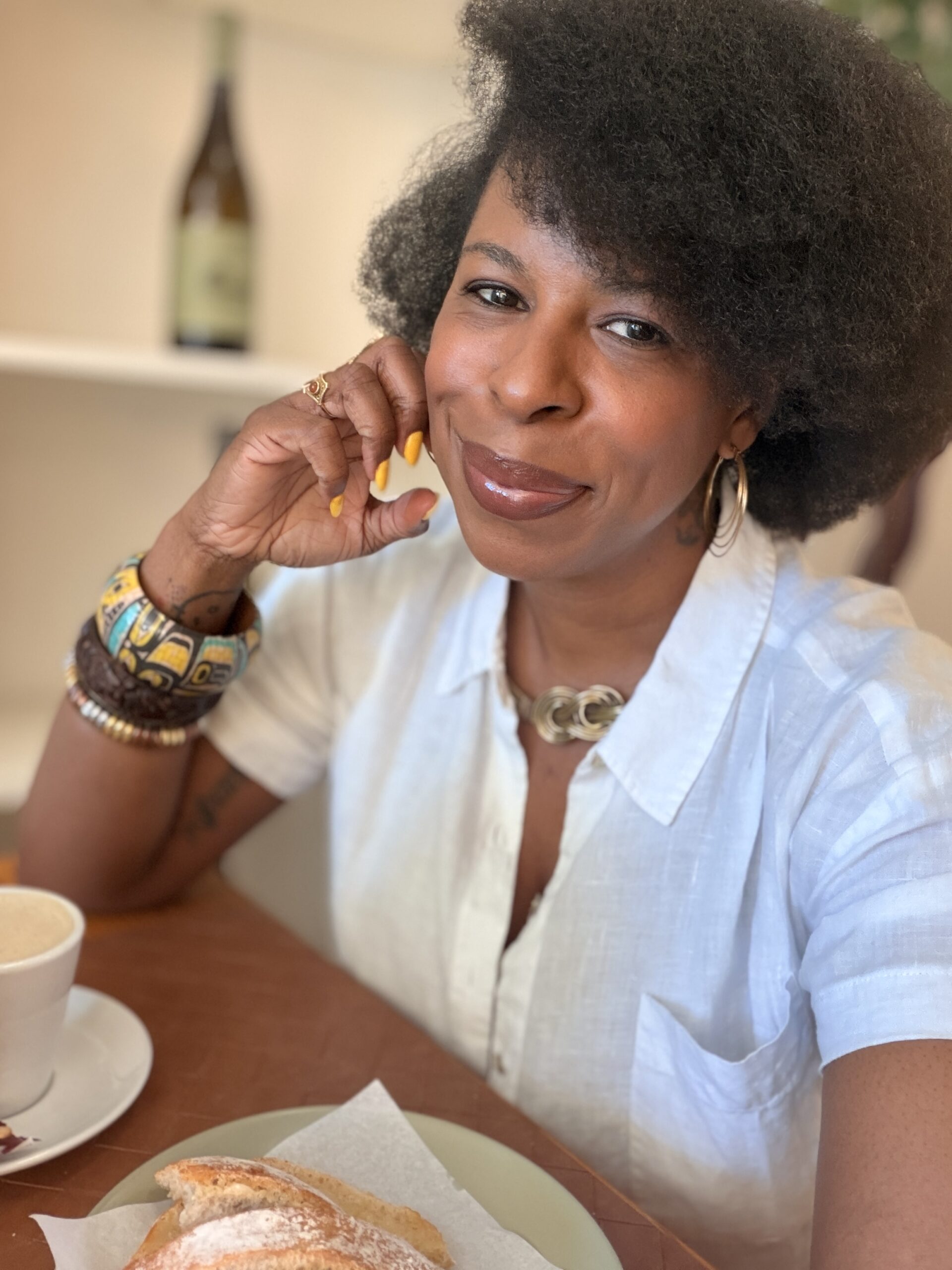 Mercedes sitting in a cafe in Guimarães, Portugal enjoying an afternoon snack