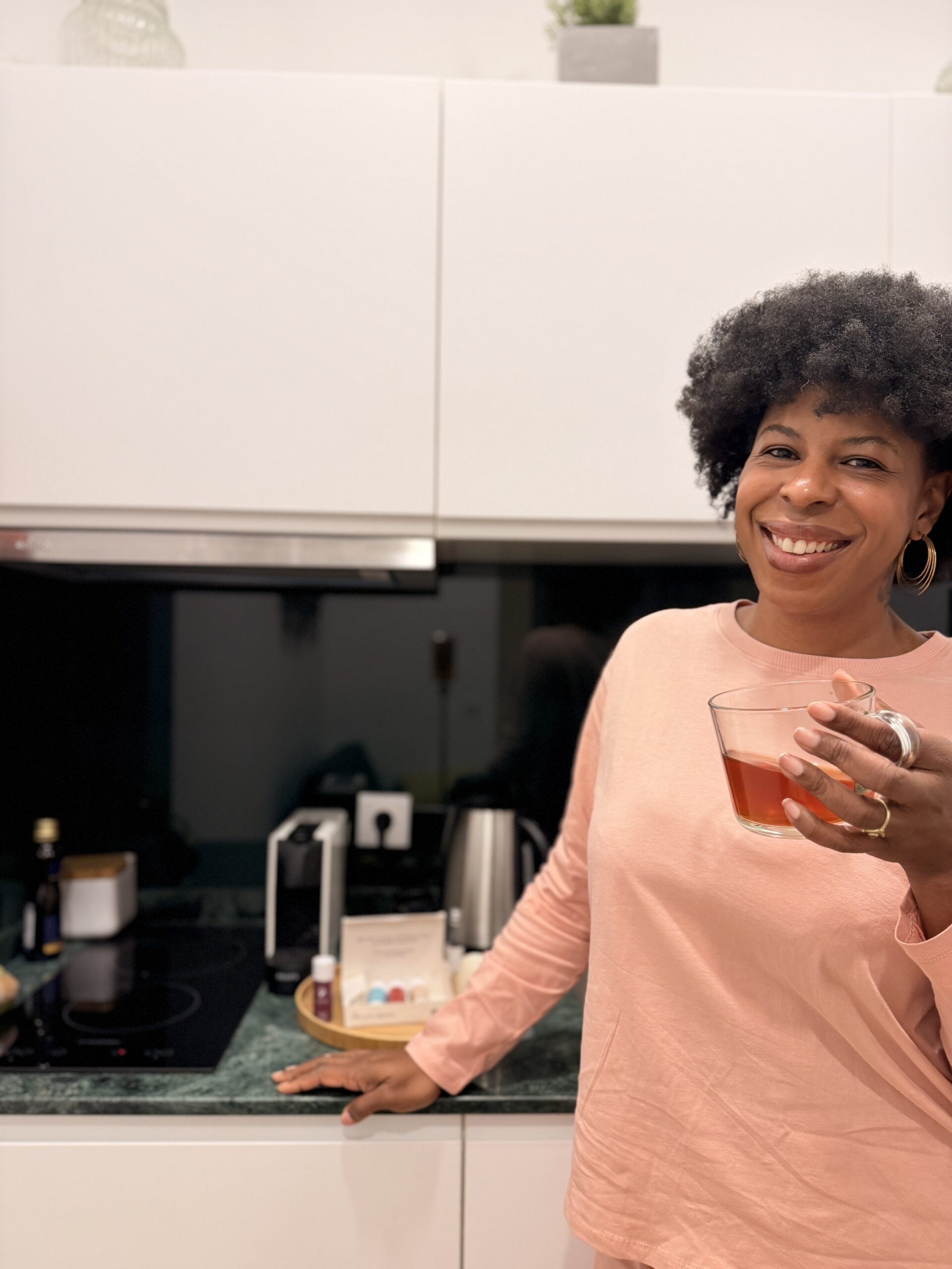 Mercedes enjoying tea in the kitchen