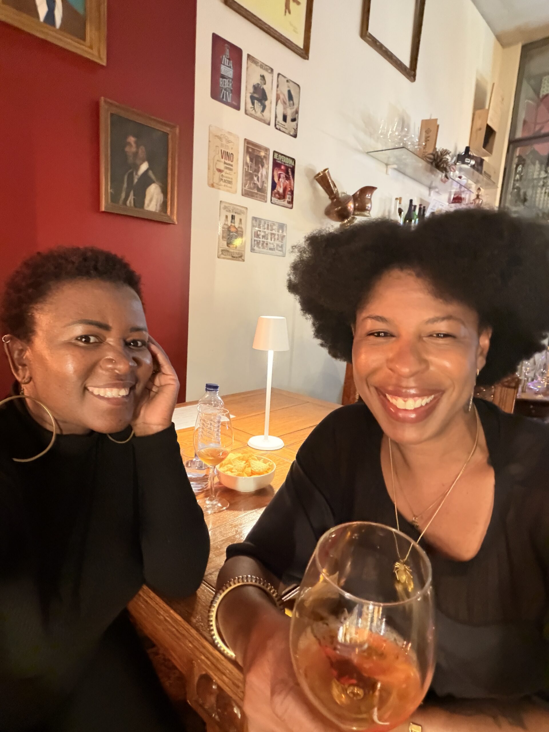 Enjoying National Wine Day - Bonita Wine Bar in Portugal. Two ladies enjoying a glass.