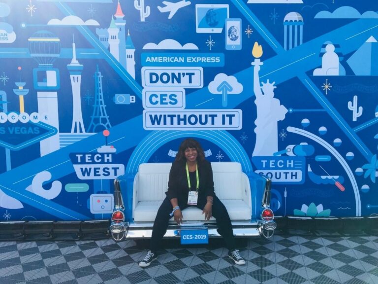 Mercedes Diane Griffin Forbes attending CES 2020 in Las Vegas, surrounded by futuristic technology displays and digital branding that capture the atmosphere of innovation, mobility, and modern tech culture.