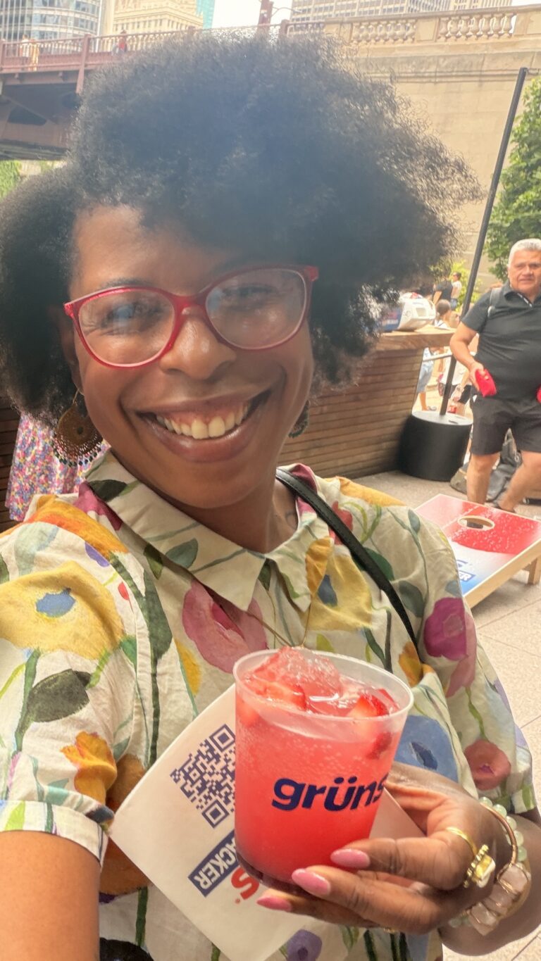 Mercedes smiling with drink at Grüns Chicago event