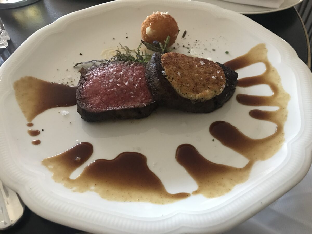 Perfectly cooked Texas steak served at a fine dining restaurant in the Dallas-Fort Worth area.