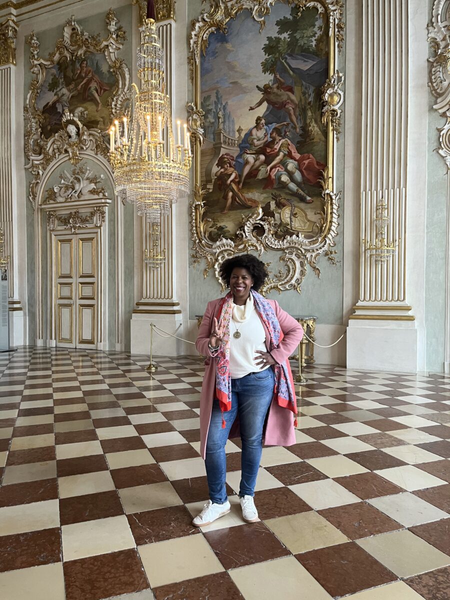 Mercedes Diane Griffin Forbes exploring the ornate interior of Nymphenburg Palace in Munich, Germany