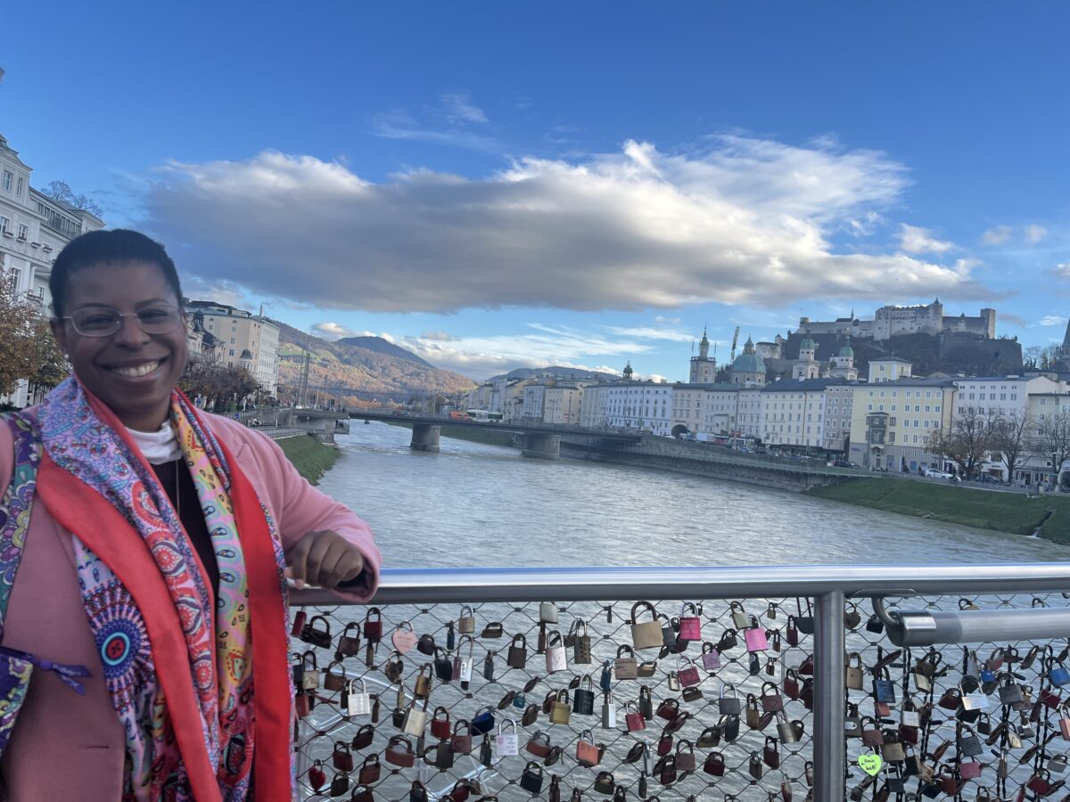 Mercedes Diane Griffin Forbes overlooking Salzburg, Austria, with Hohensalzburg Fortress and the Salzach River in the background.