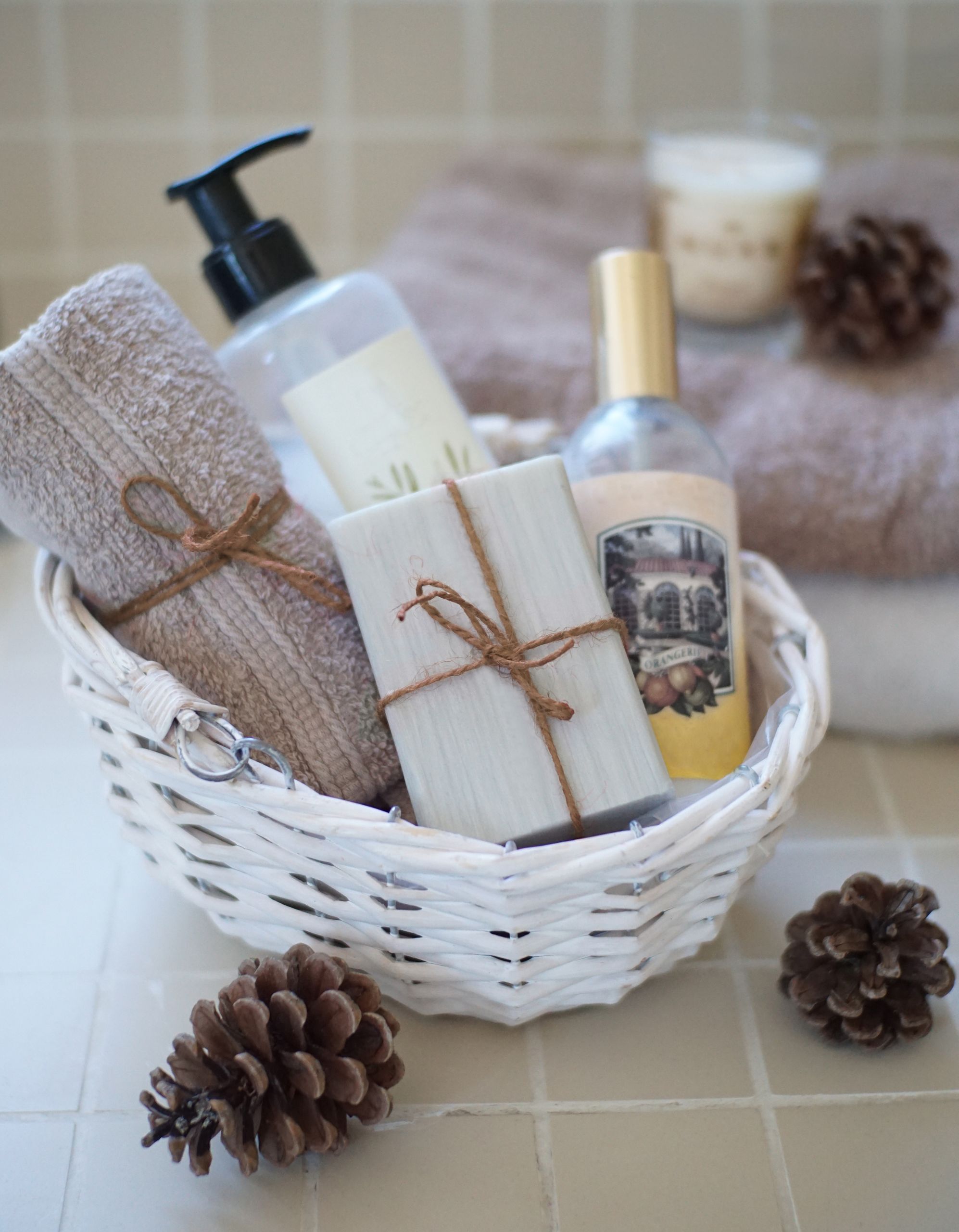 Airbnb Bathroom Essentials: How to Create a Five-Star Guest Experience - Luxurious spa basket featuring soaps, towels, and skincare products for a relaxing bath experience.