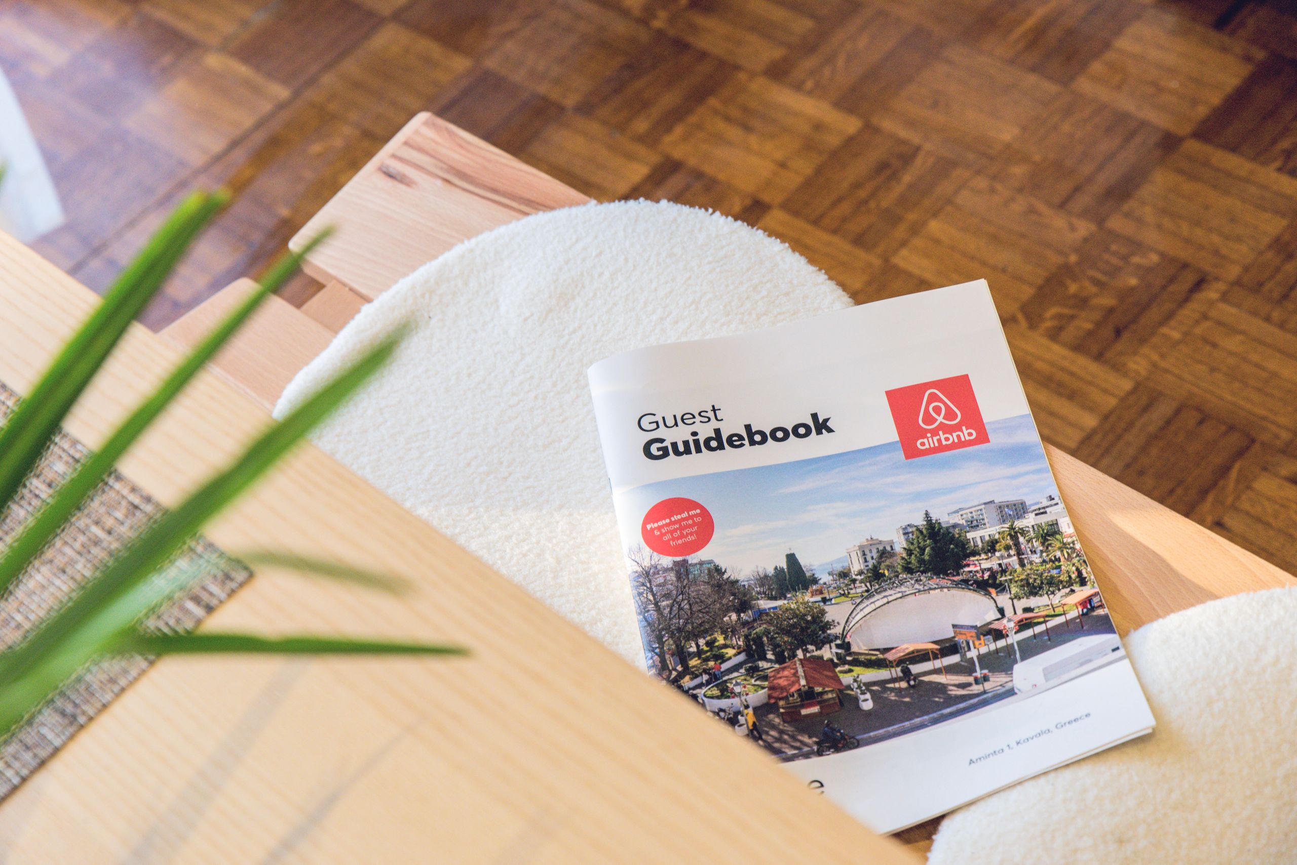 Airbnb Welcome Book: Everything Your Guests Need in One Simple Guide - Airbnb Welcome Book: Everything Your Guests Need in One Simple Guide - Airbnb Guest Guidebook on a modern table in Kavala, Greece home.