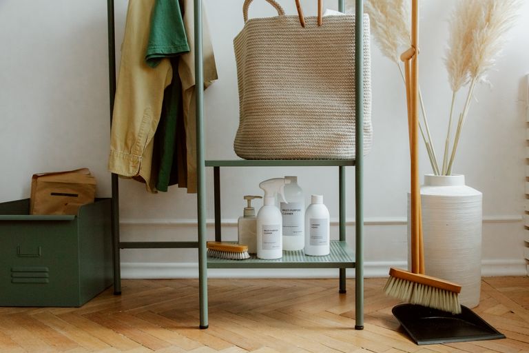Airbnb Supplies Checklist: The Must-Have Items Every Host Should Keep Stocked - Eco-friendly cleaning products and home storage solutions in a modern, minimalist interior.