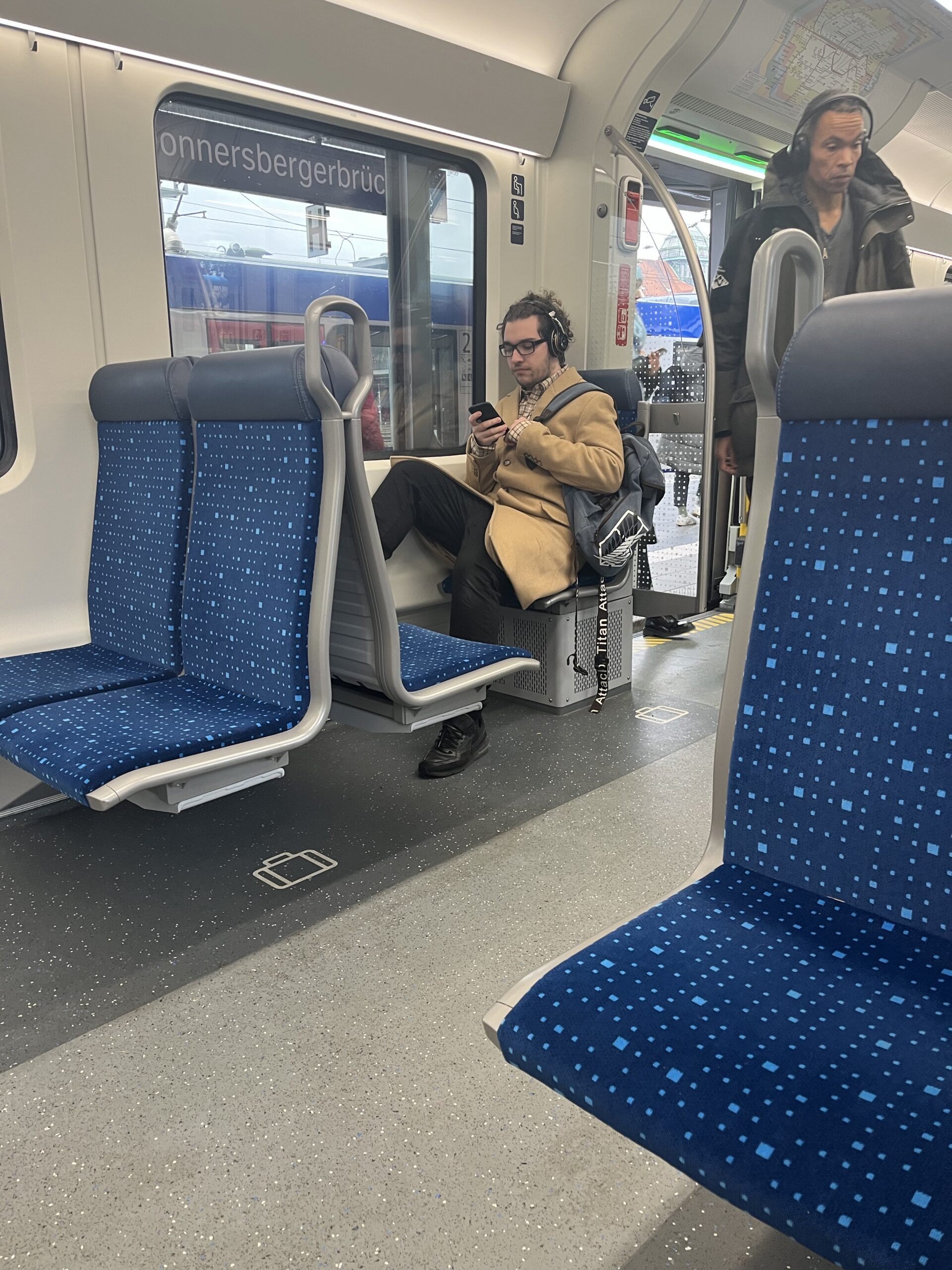 Passengers on a regional train through Bavaria