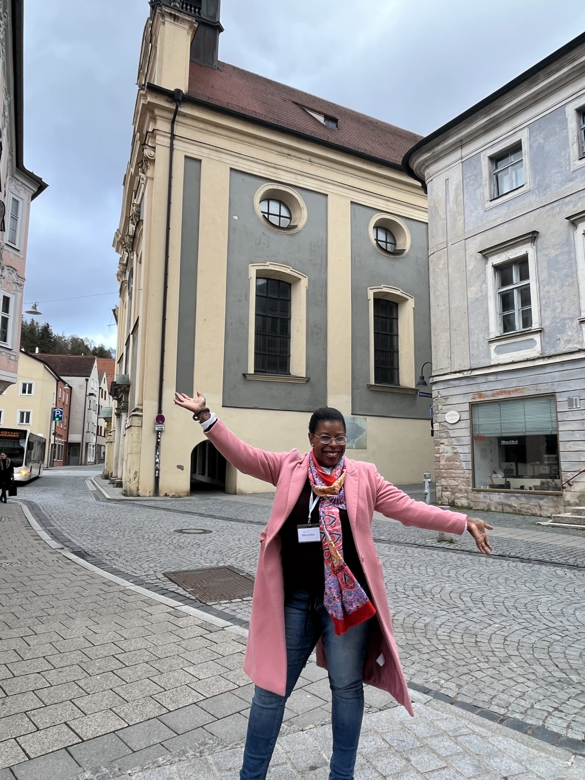 Black woman traveler on a cobblestone street in Füssen