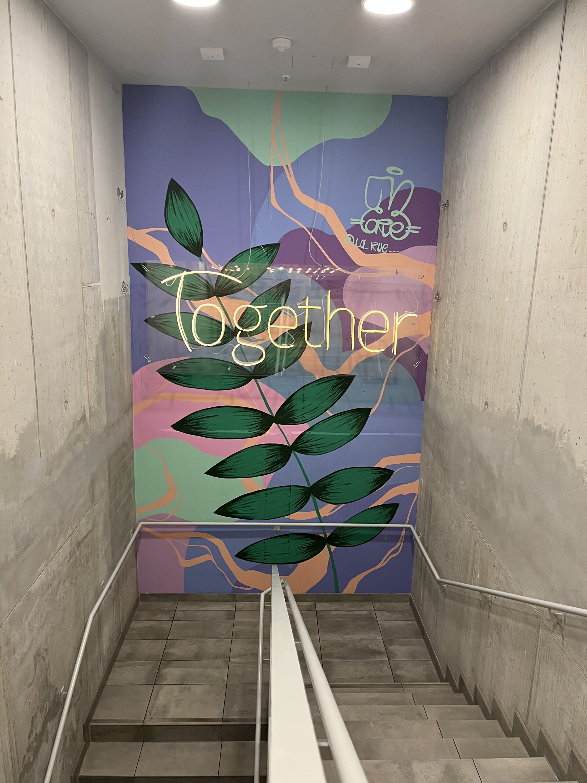 Colorful Together mural inside Wombat’s City Hostel Munich Werksviertel