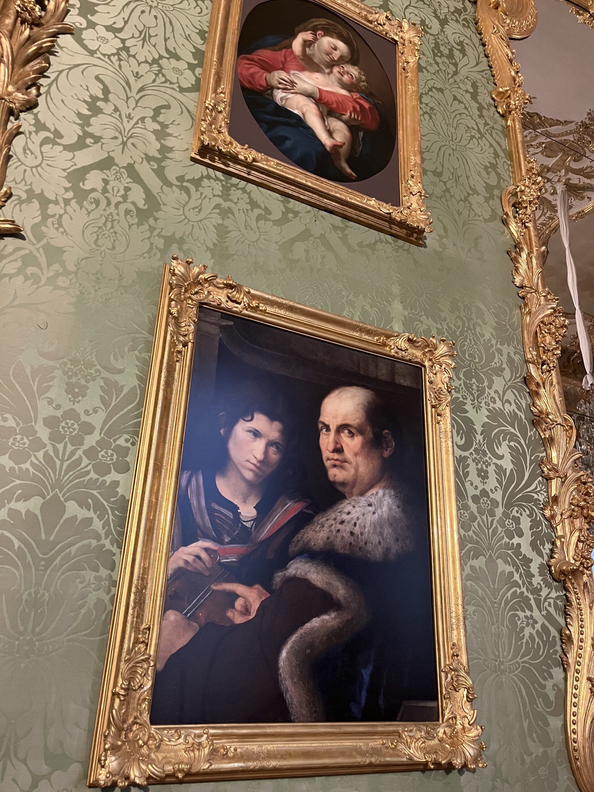 Historic portraits in gilded frames inside the Munich Residenz
