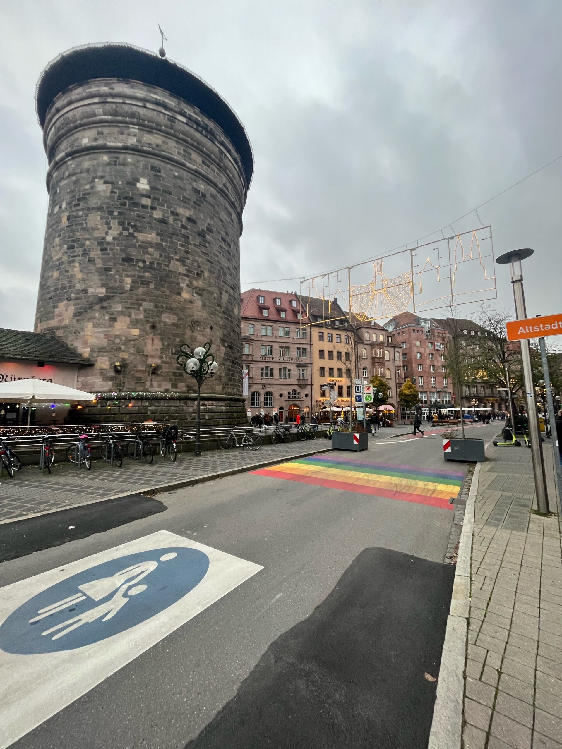Round medieval Frauentorturm beside a rainbow crossing near Nuremberg Old Town