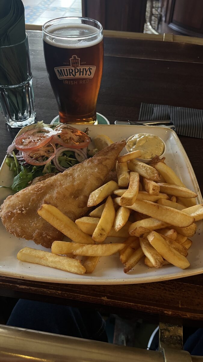 Murphy’s Irish Red served with traditional fish and chips at Murphy’s Irish Pub in Amsterdam Schiphol Airport.