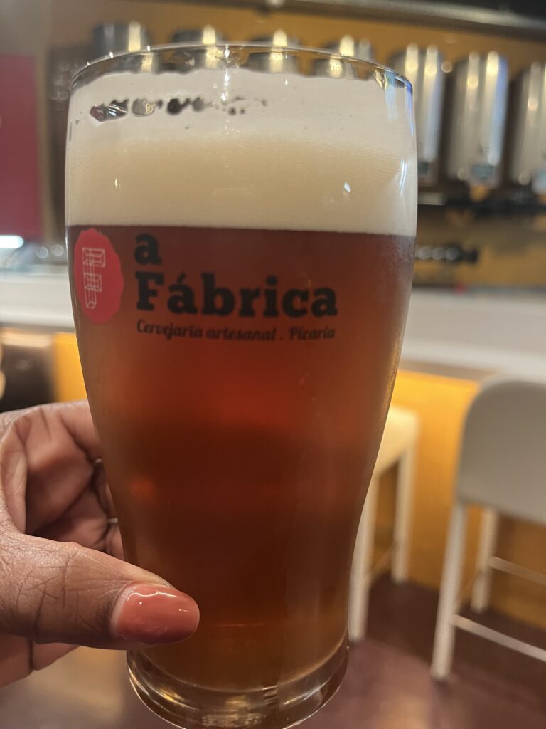 Glass of Morenita craft beer by A Fábrica Brewpub enjoyed in Portugal.