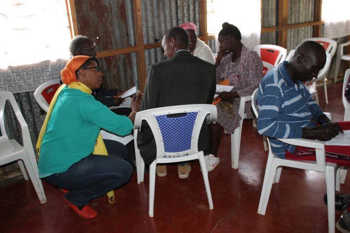 Mercedes Diane Griffin Forbes facilitating a strategic planning workshop with smallholder farmers and agricultural leaders in Kenya.