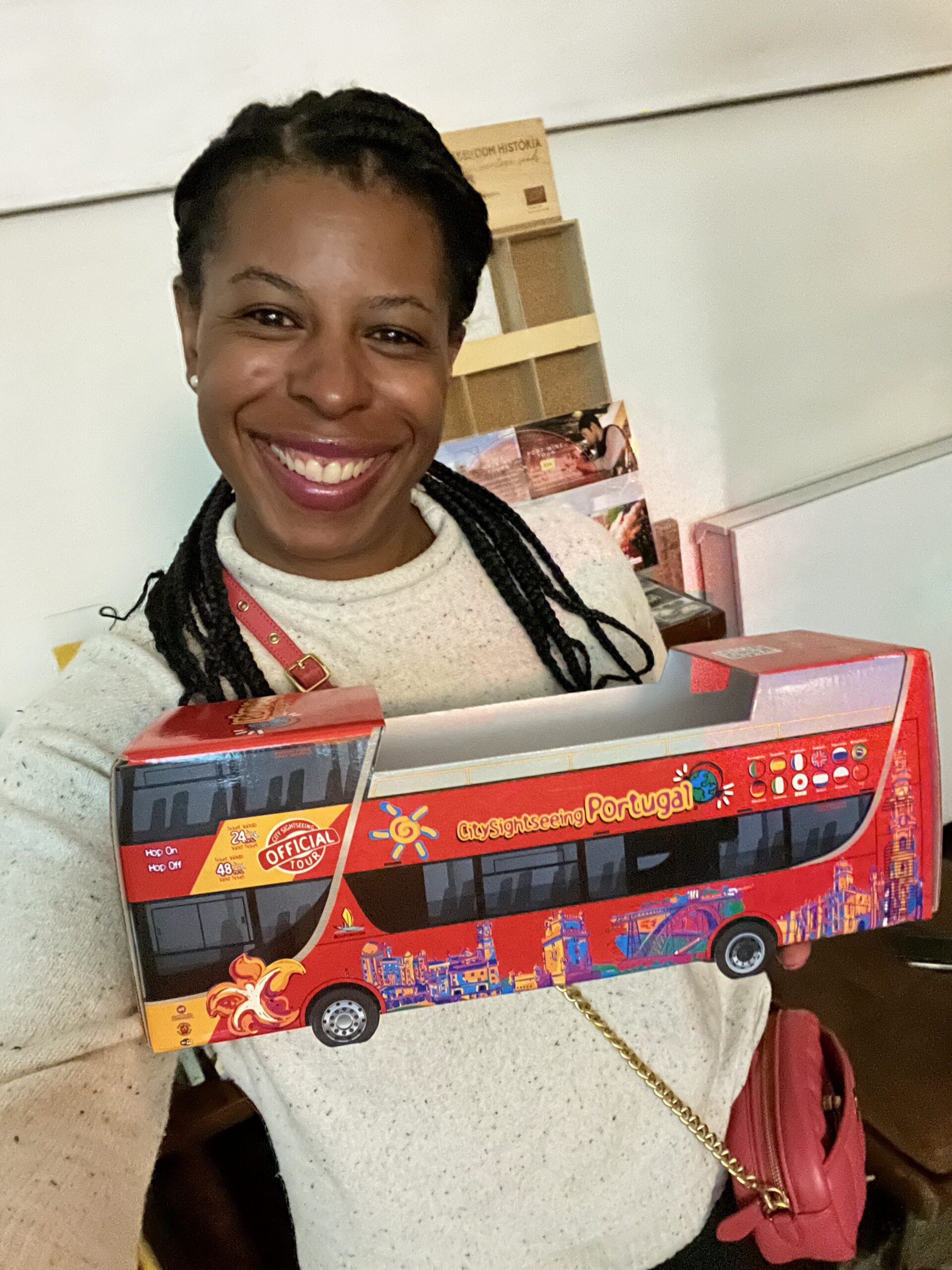 Why I Keep Coming Back to Portugal - Mercedes holding a tiny city sightseeing bus