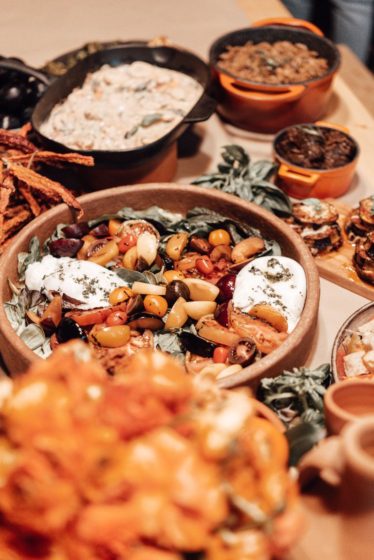 A Full Table Is More Than a Beautiful Meal - Rustic Mediterranean food spread with fresh ingredients and vibrant colors, perfect for food photography.