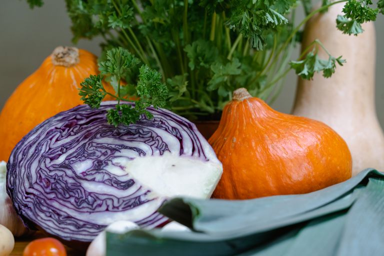 Fall-ing for These 5 Natural Whole Foods Products - Colorful assortment of fresh vegetables including pumpkin, red cabbage, and parsley highlighting healthy eating.