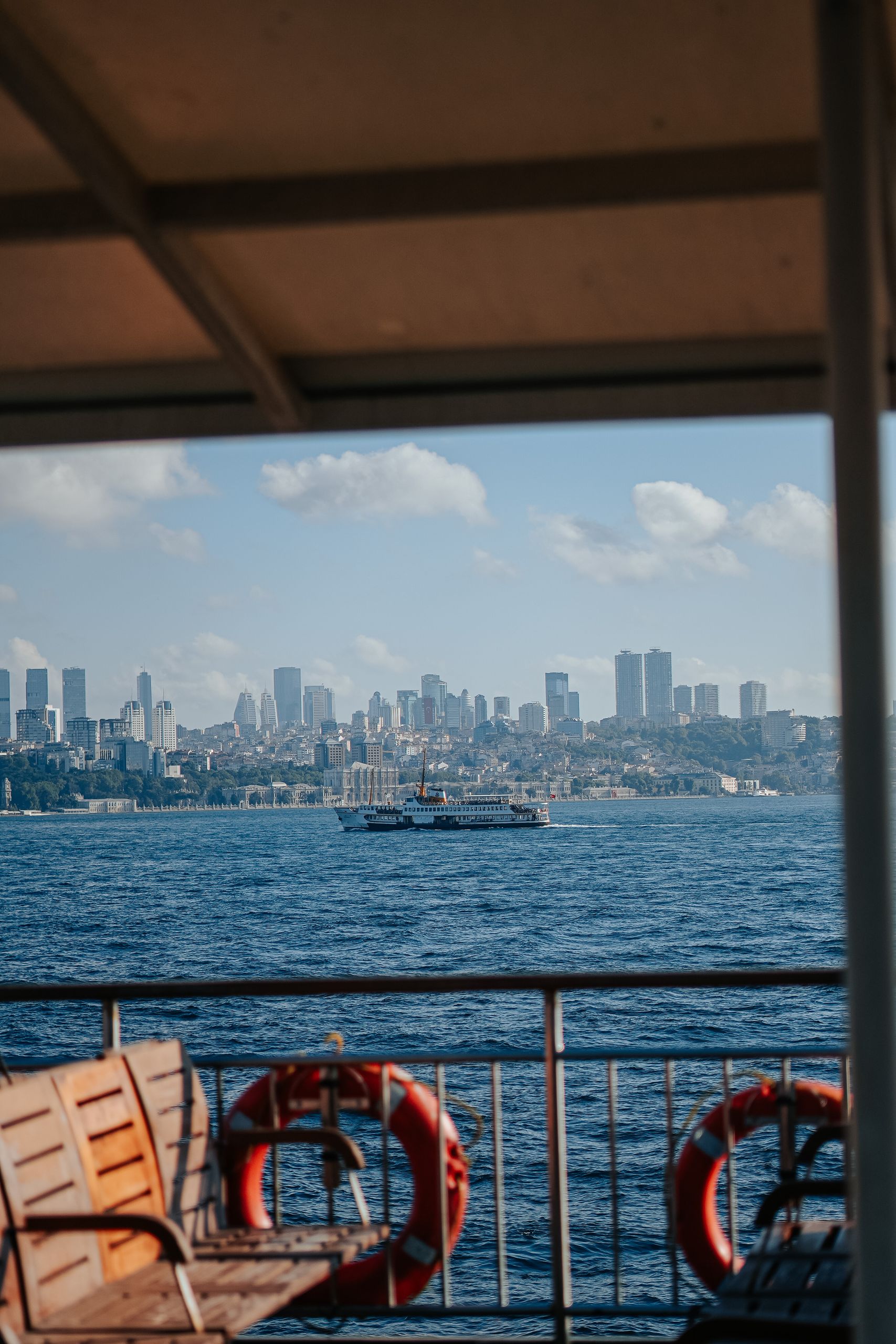 Ferry Ride Teaches Me About Crossing Over - Stunning city skyline as seen from a ferry crossing the ocean on a sunny day.