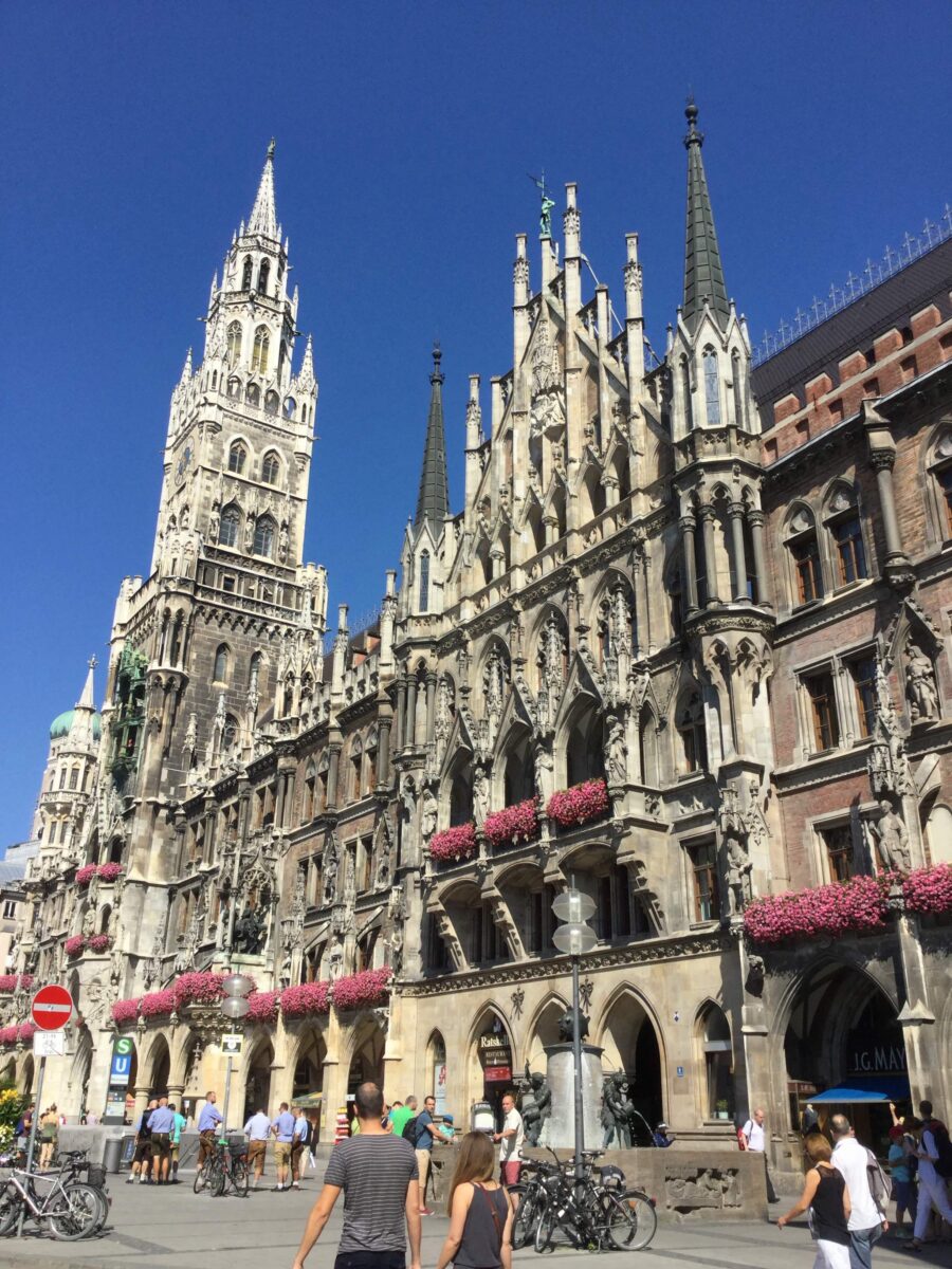 Gothic Revival façade and clock tower of Munich New Town Hall at Marienplatz under a blue sky