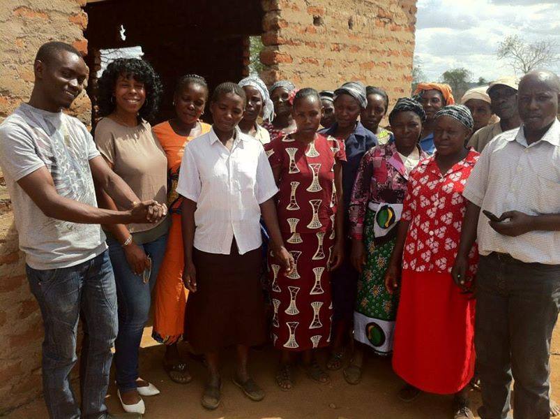 Mercedes Diane Griffin Forbes posing with workshop participants following a farmer organization training in Kenya.