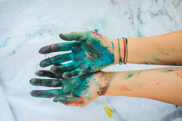 Product Review: Happlee Washable Finger Paints - Close-up of two hands covered in vibrant paint, showcasing creative expression and artistic freedom.
