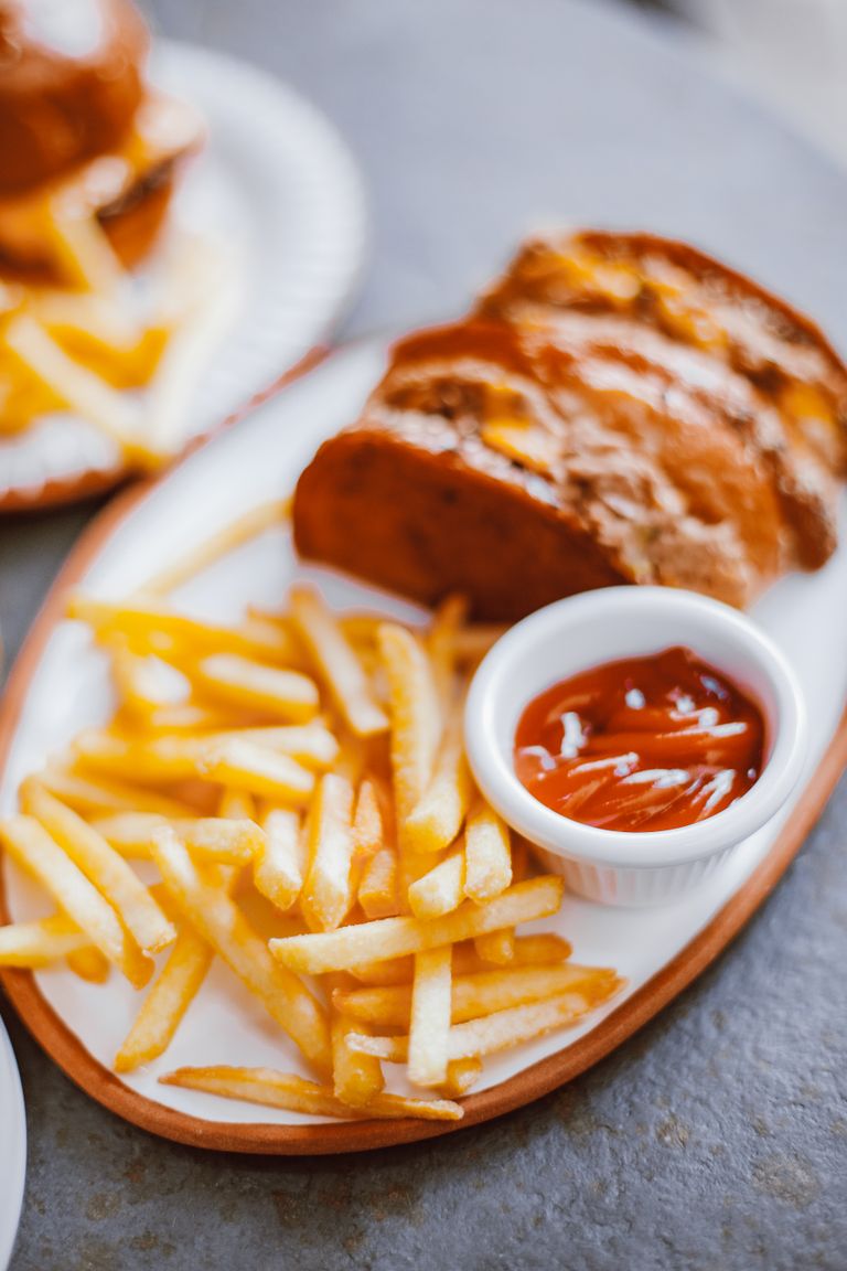 Why Food Tastes Better After a Long Day Outside - Tasty french fries served with ketchup on a plate, perfect for food photography.