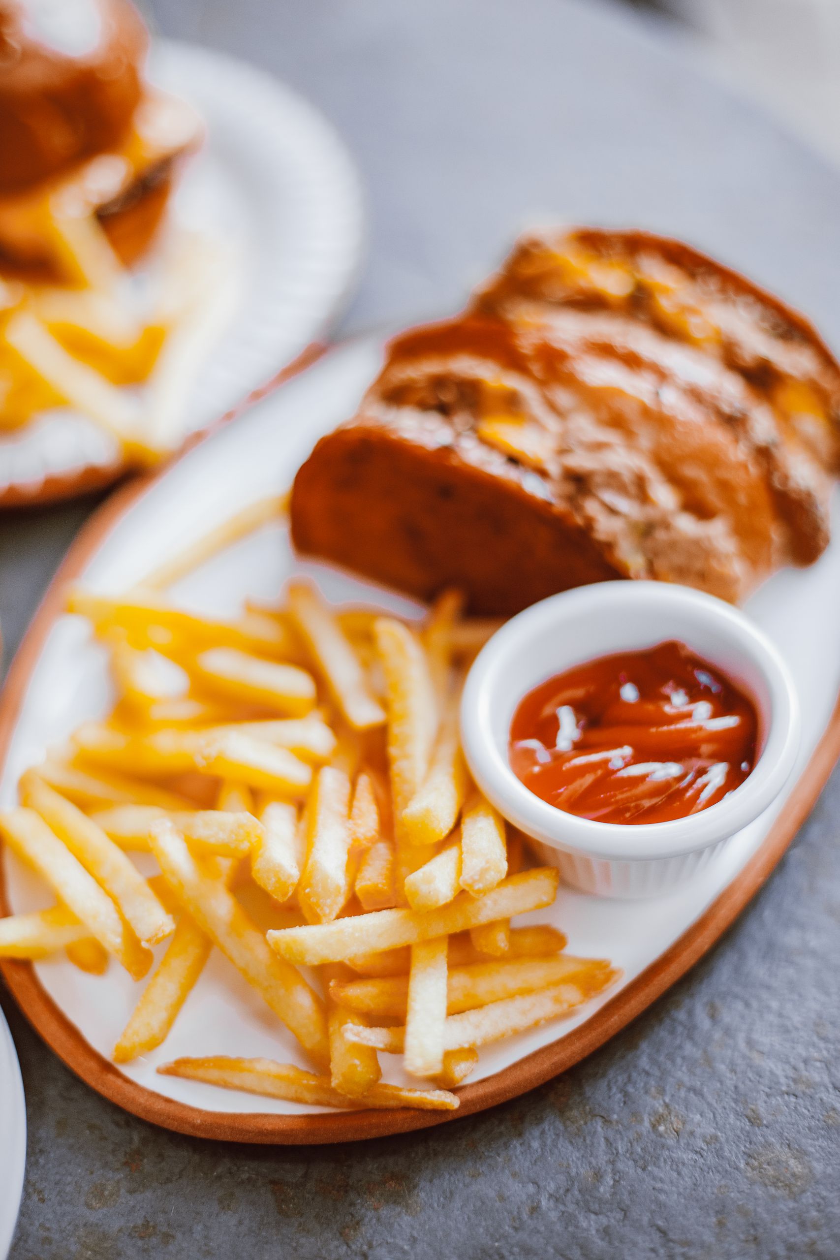Why Food Tastes Better After a Long Day Outside - Tasty french fries served with ketchup on a plate, perfect for food photography.