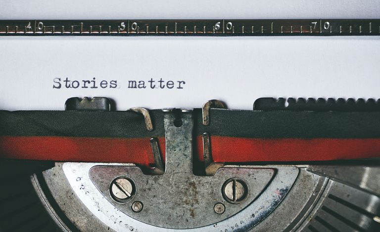 Why Storytelling Builds Better Leadership - Close-up of a vintage typewriter with the text 'Stories matter' typed on paper, evoking nostalgia.