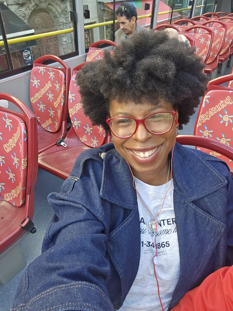 Mercedes on a sightseeing bus in Porto, Portugal - Why I Am Learning to Travel With More Tenderness
